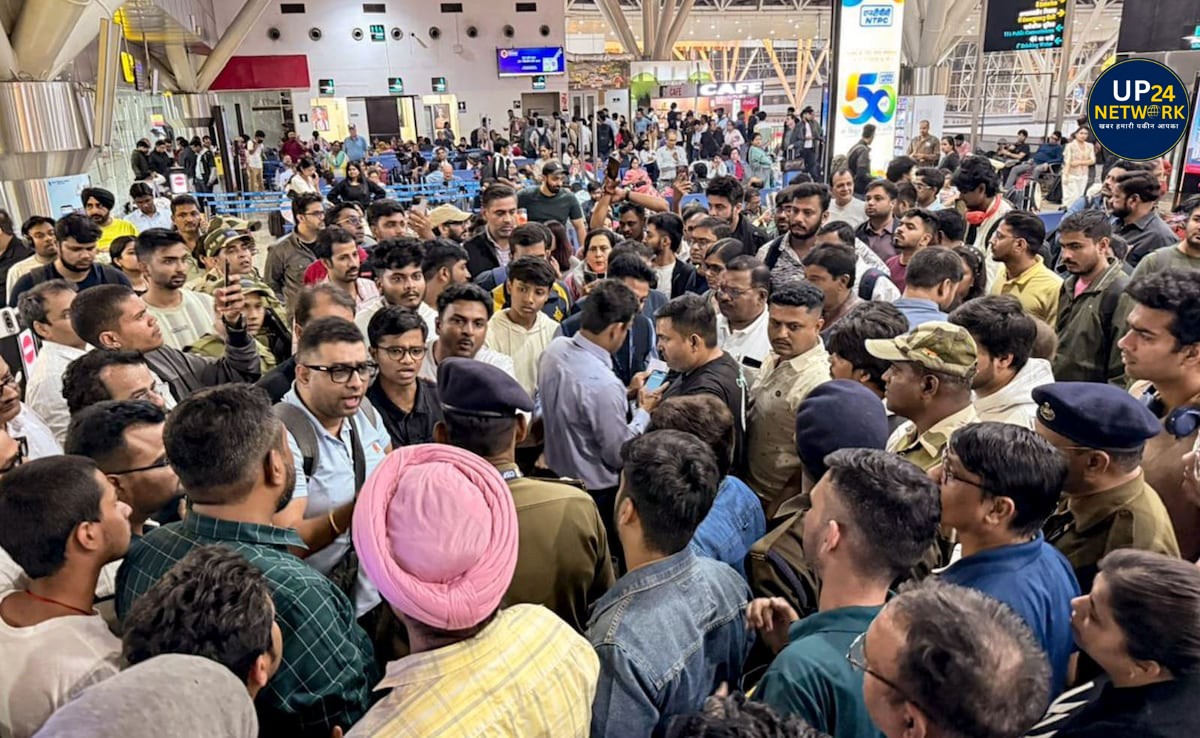 Crowded airport scene with passengers waiting.