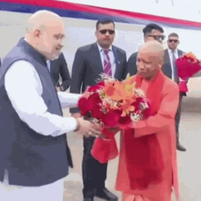 यूपी दिवस पर अमित शाह लखनऊ पहुंचे, CM योगी ने स्वागत