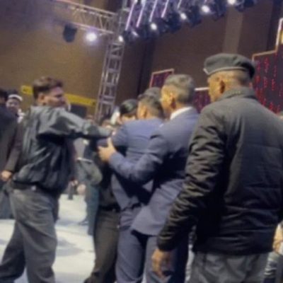 Crowd chaos at birthday celebration event.